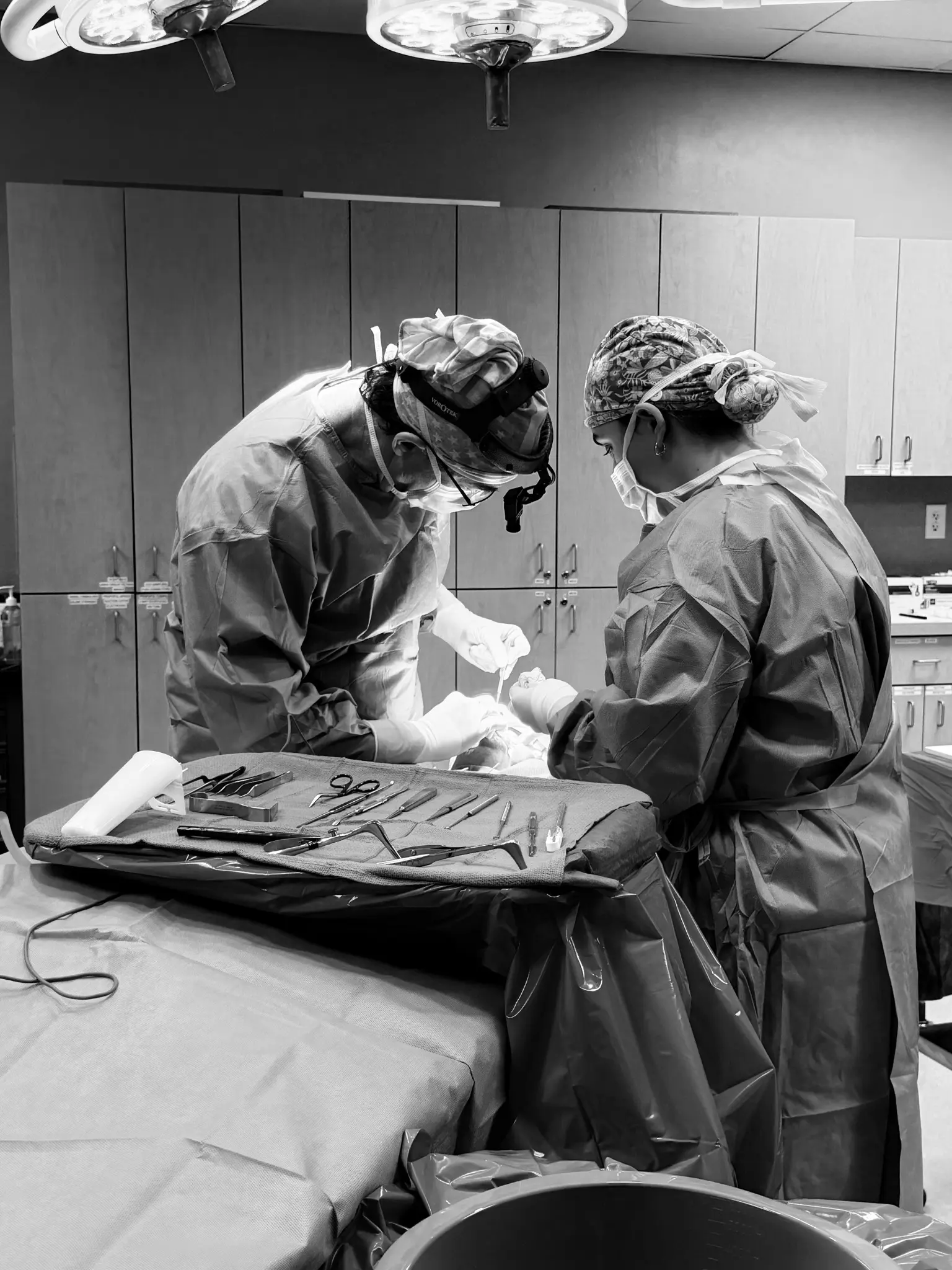 Dr. Prendiville and a surgical assistant in the operating room